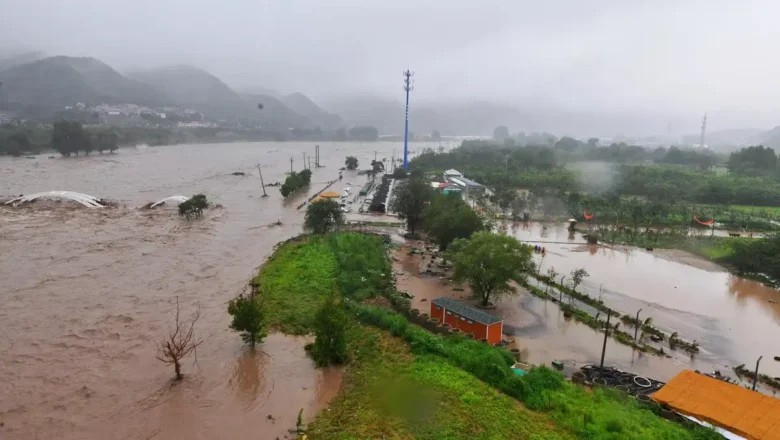 China swollen rivers trigger mass evacuations, test fragile flood defenses