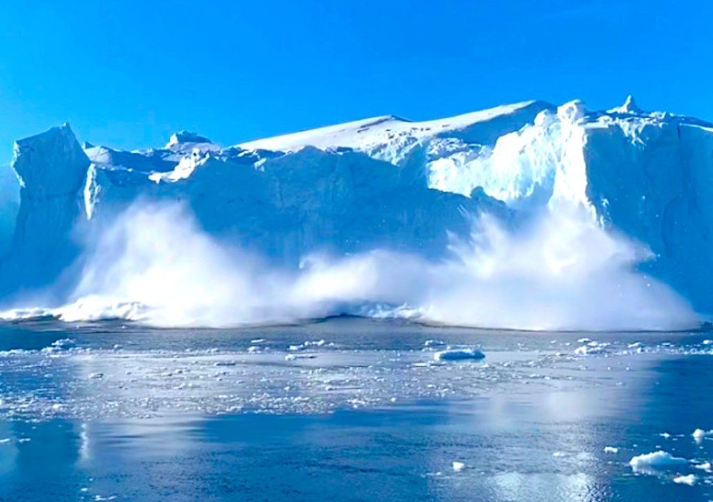 A Massive Iceberg Flips off Greenland Coast Amid Accelerating Iceberg Loss